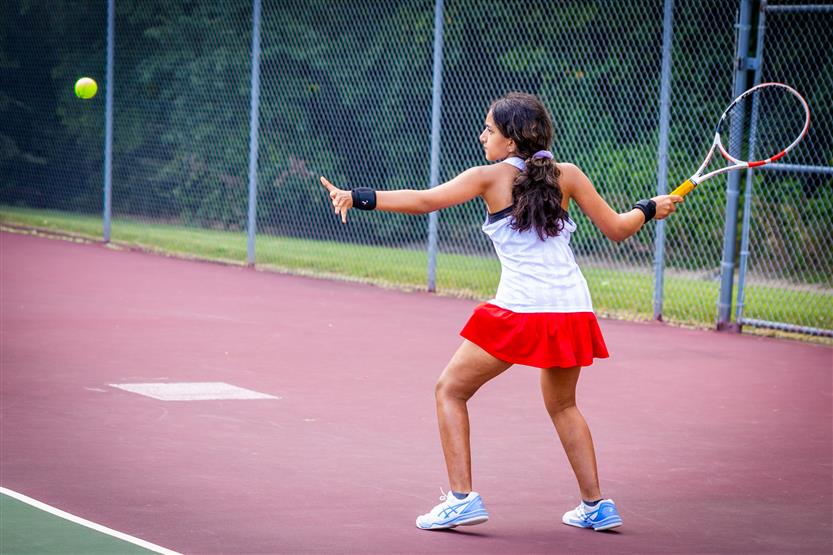 A tennis player hits the ball